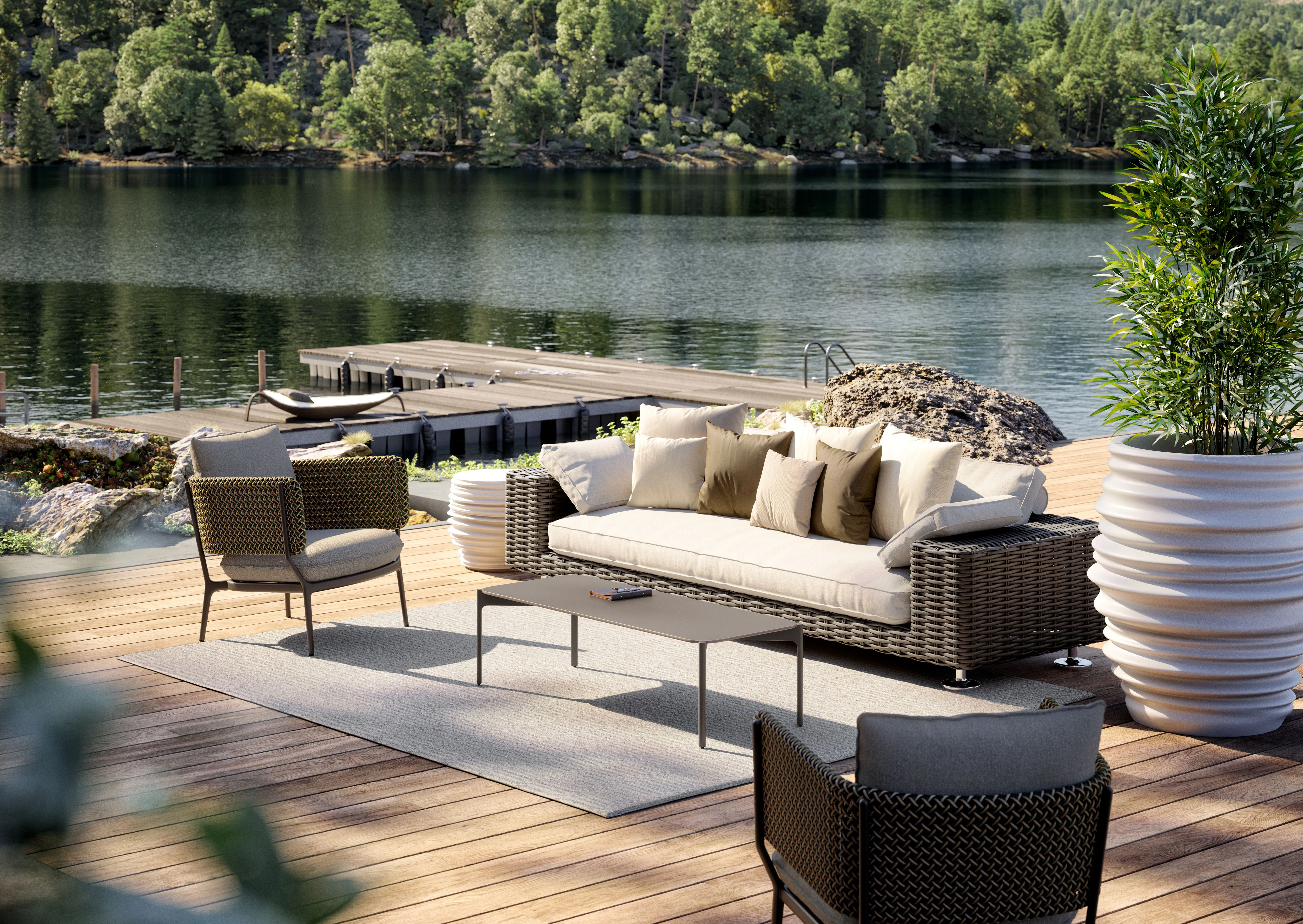 Bild des Dedon Sofa Paros mit Stühlen vor einem See